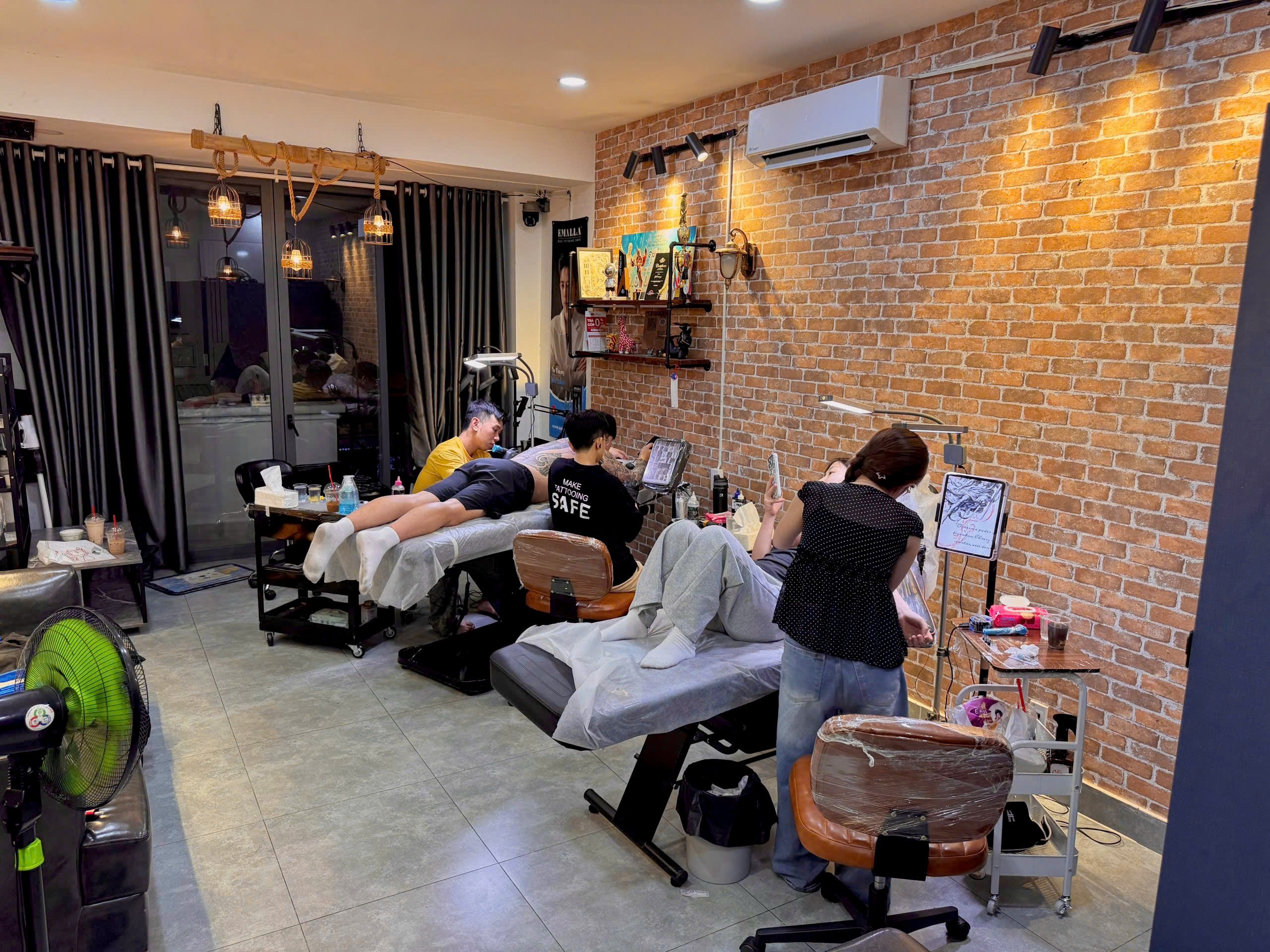 busy tattoo studio ho chi minh city real clients yotinny tattoo